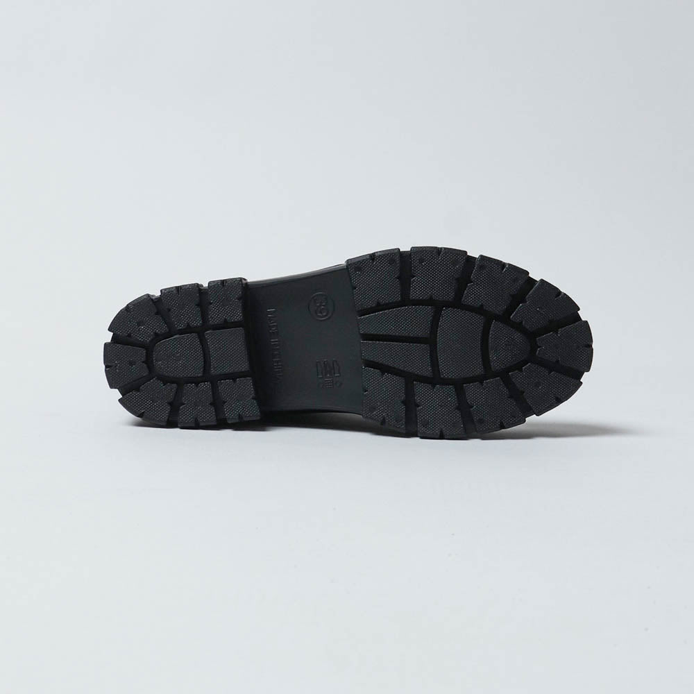The rubber lug sole of The Cherry Drop