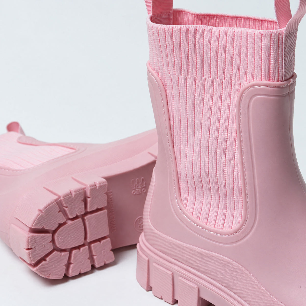 The Cherry Drop rain boot in Blossom, close-up of the knit panel and lining