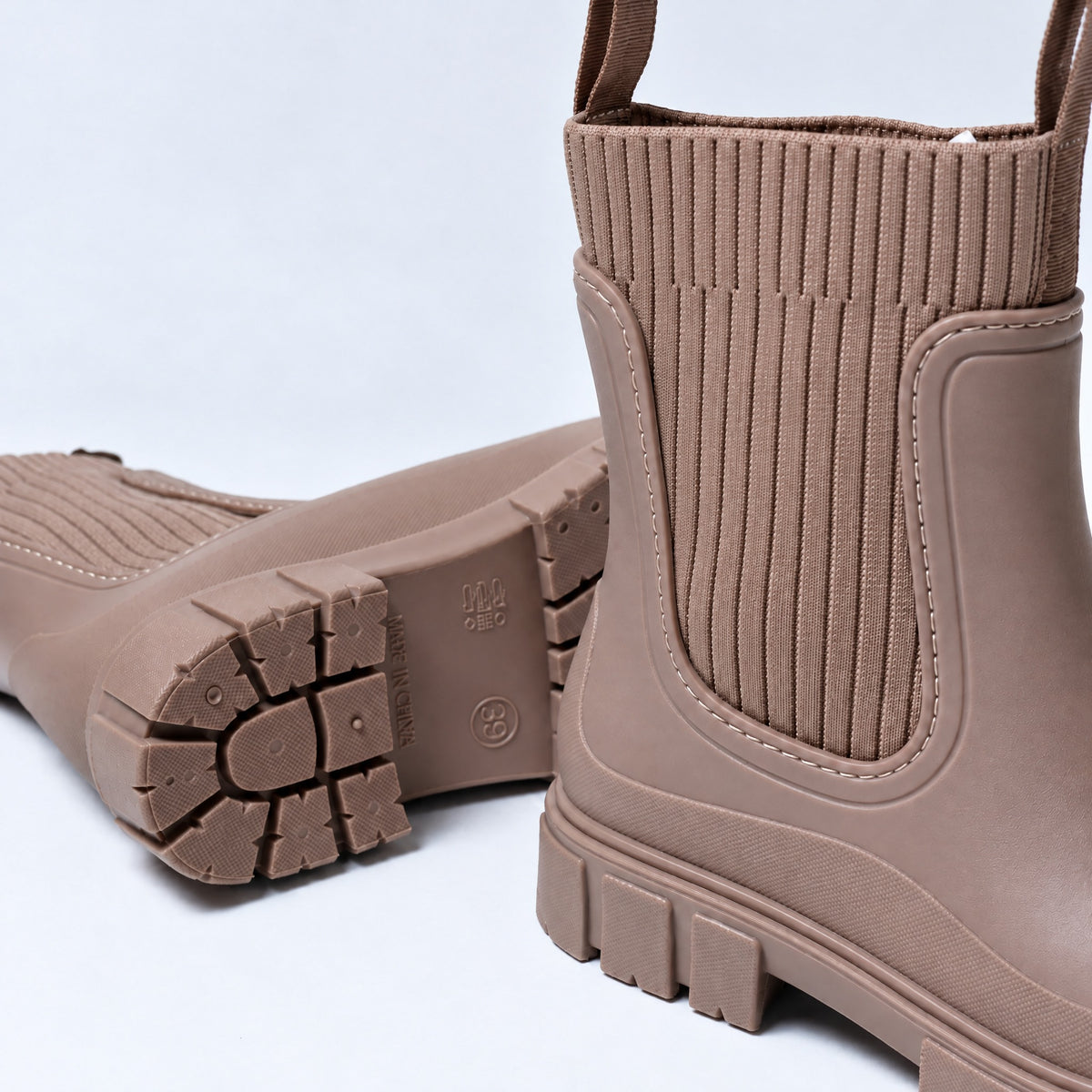 The Cherry Drop rain boot in Cherry Stone, close-up of the knit panel and lining
